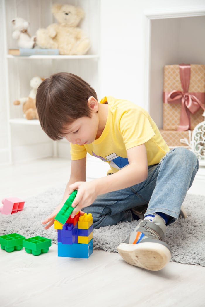 The Art of Drawing Readers In: Your attractive post title goes here Young child playing with colorful building blocks, showcasing creativity and fun indoors.